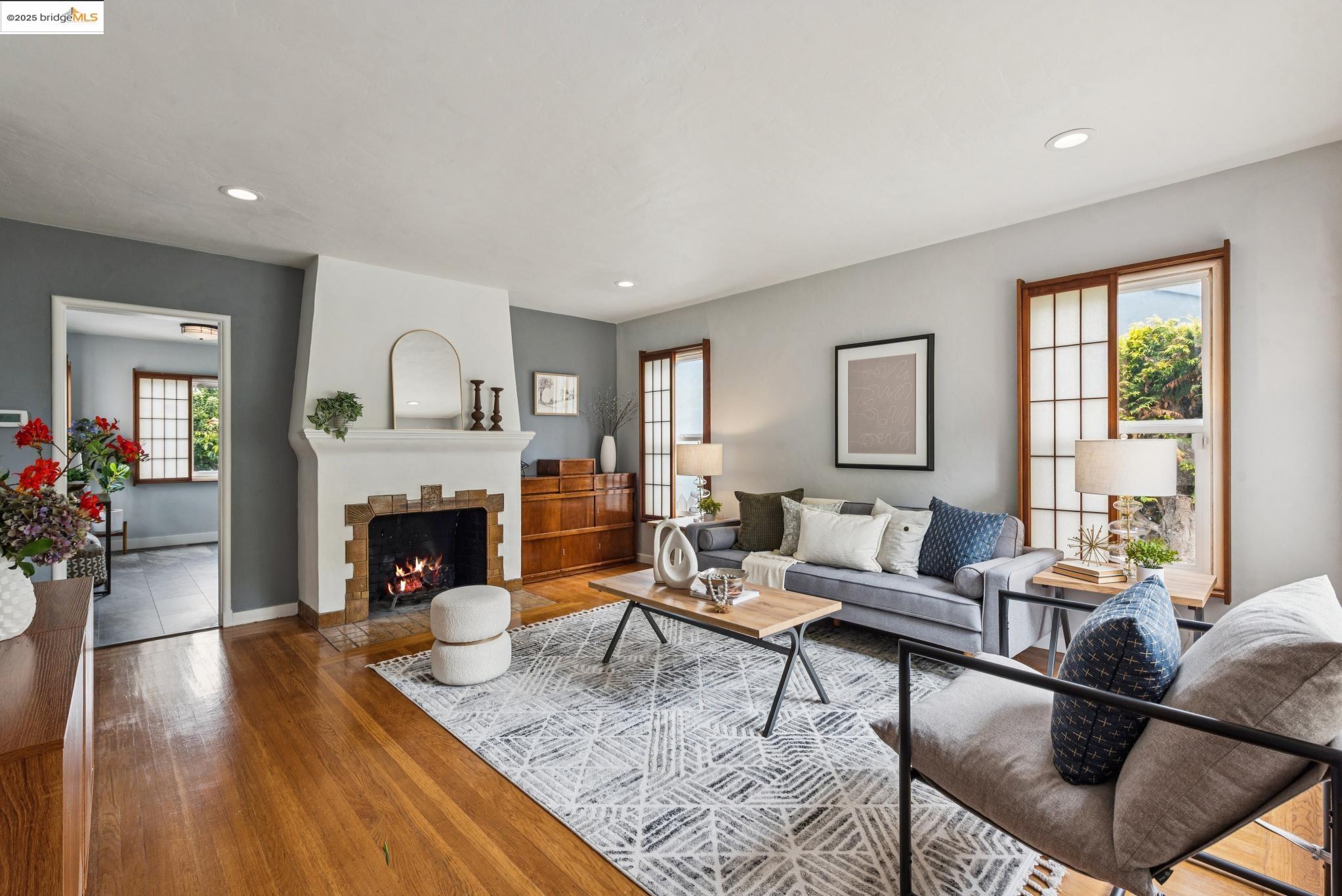 2416 Valley Street Berkeley, CA 94702 - Photo 1 of 1 a living room with furniture and a fireplace