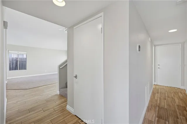 a kitchen with stainless steel appliances granite countertop wooden cabinets and a stove top oven