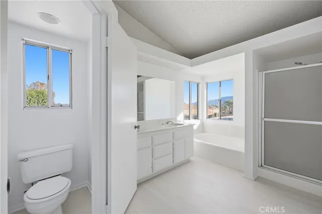 an empty room with chandelier fan