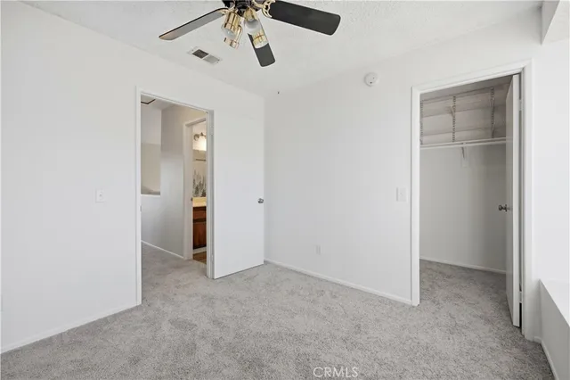 a view of a patio with a table and chairs
