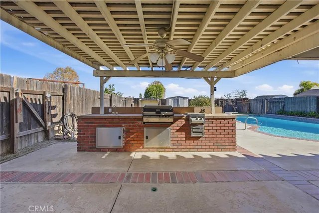 a view of a house with a swimming pool and a yard