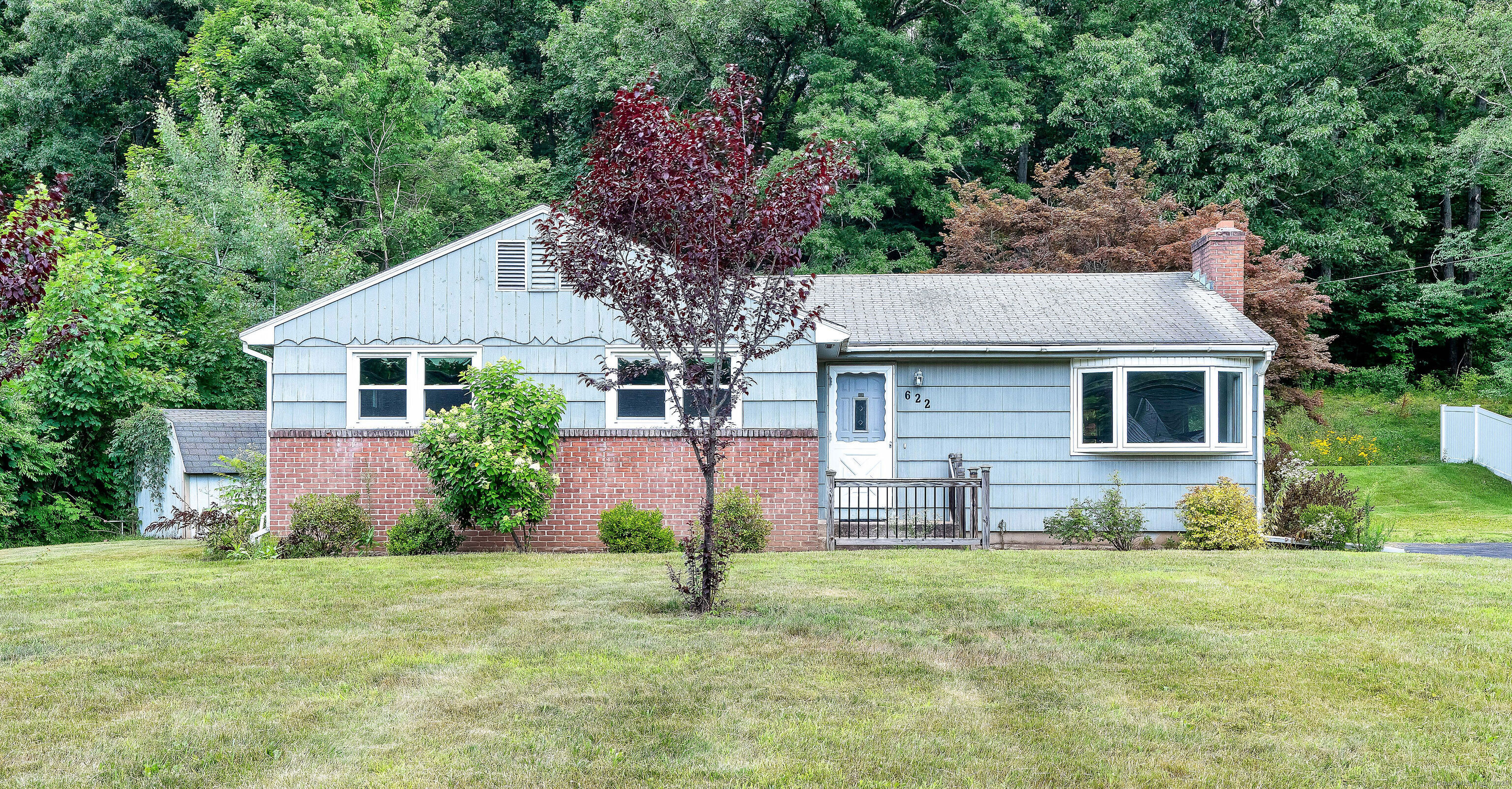 622 Stone Road Windsor, CT 06095 - Photo 1 of 1 a aerial view of a house with a yard and potted plants