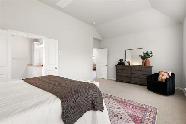 a bedroom with a bed and a couch