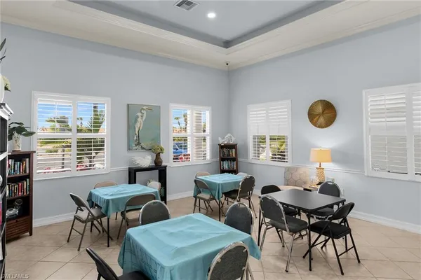 a view of a dining room with furniture and windows
