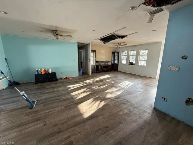 a view of a livingroom with furniture and a window