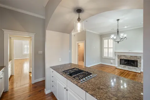 a kitchen with a stove a sink and a refrigerator