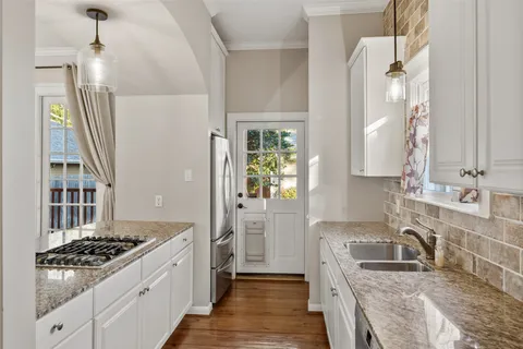 a kitchen that has a sink and a window