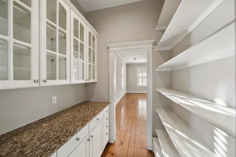 a bathroom with a toilet a sink and a mirror