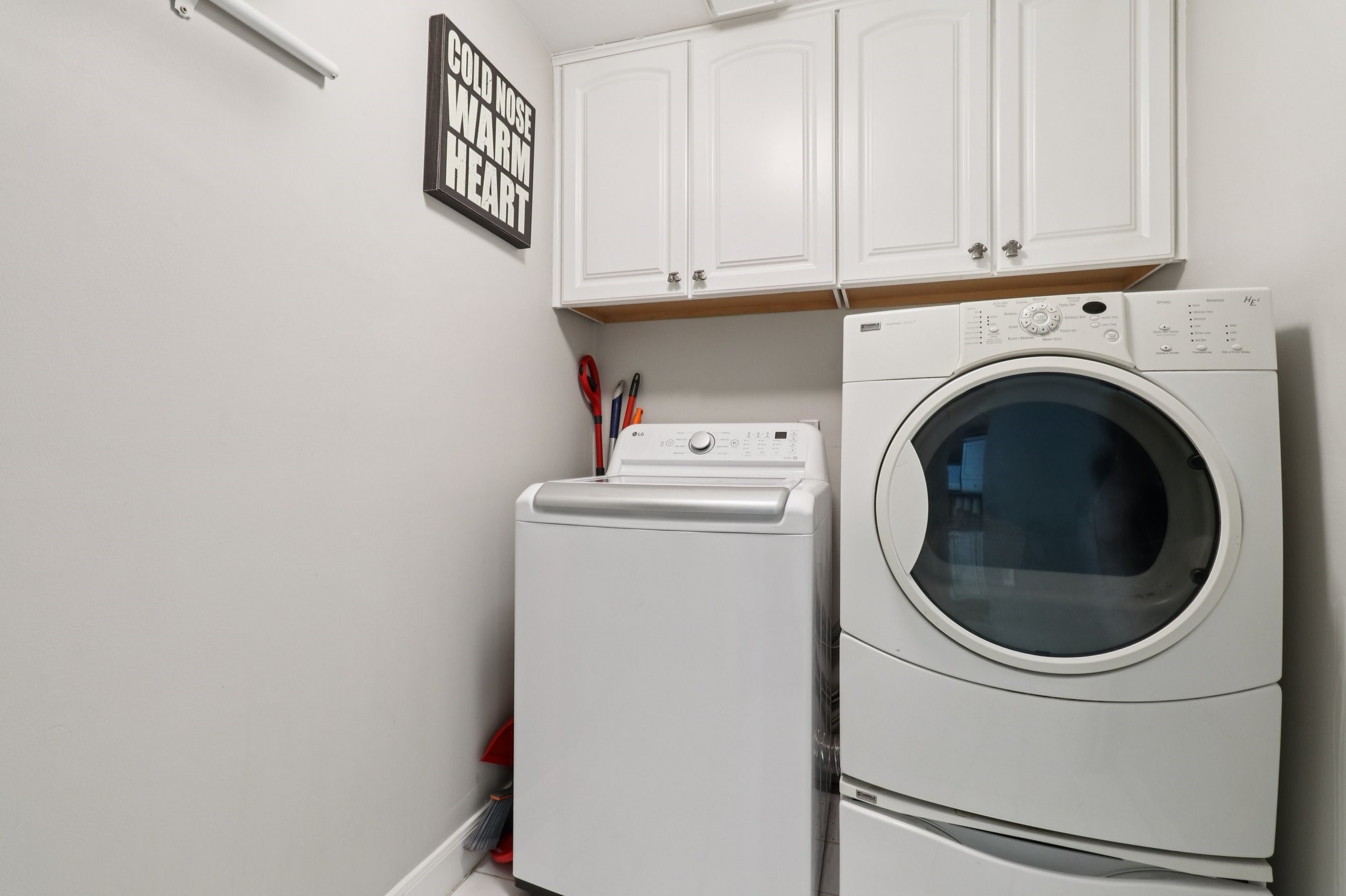 1342 Allston Street Houston, TX 77008 - Photo 17 of 39 Dedicated first-floor laundry room with full-size washer and dryer and built-in storage.