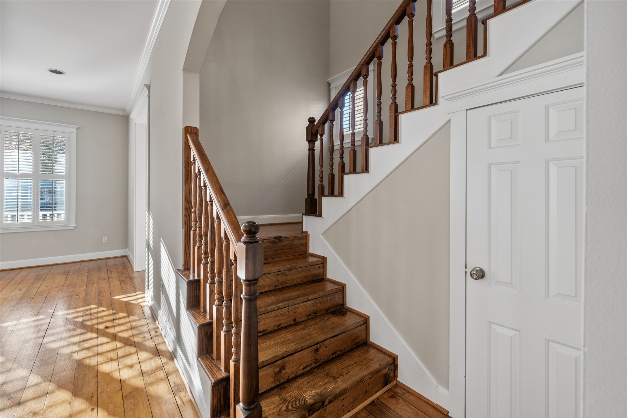 1342 Allston Street Houston, TX 77008 - Photo 18 of 39 Period staircase details continue upstairs to the private bedroom level.