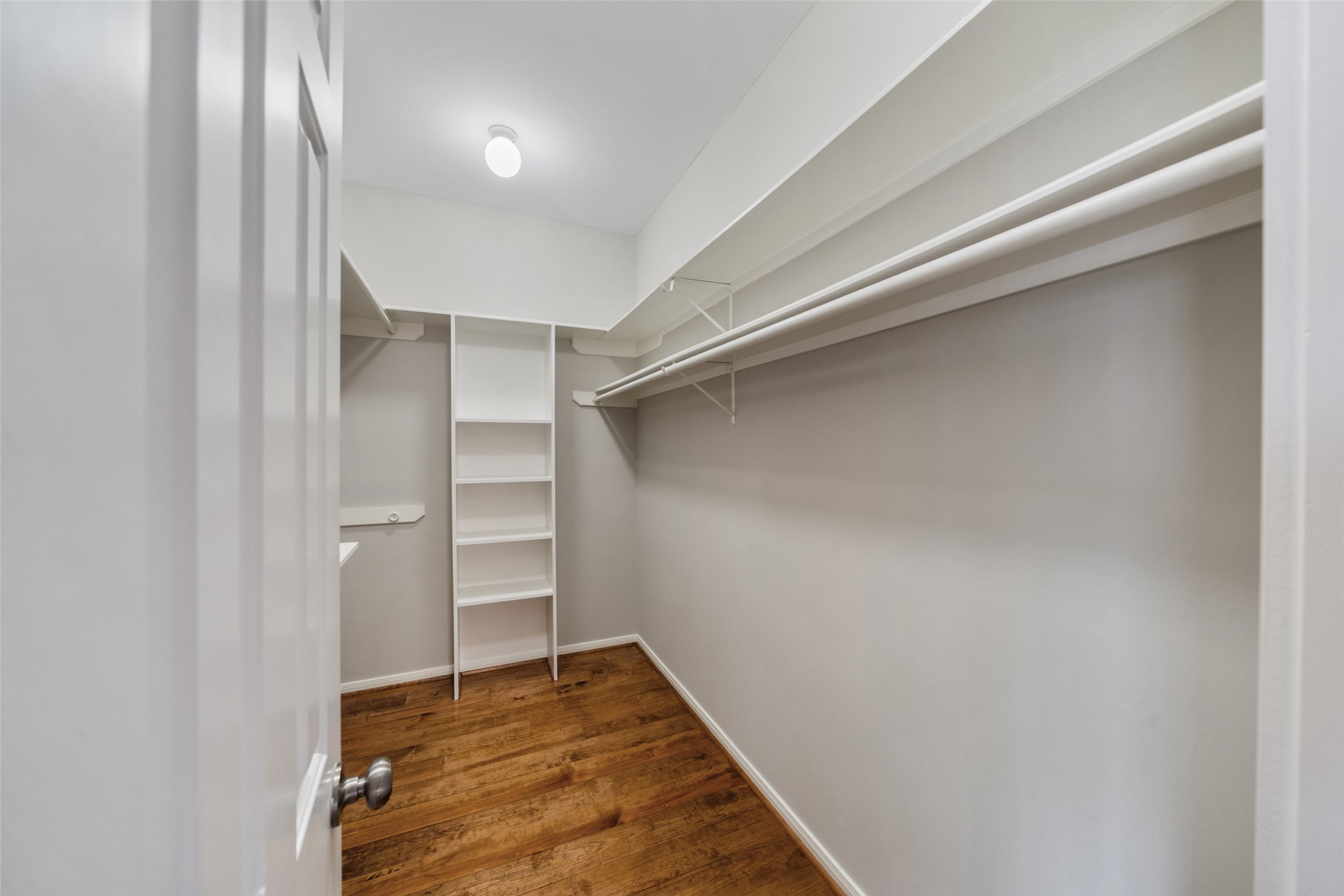 1342 Allston Street Houston, TX 77008 - Photo 21 of 39 Walk-in closet with built-in shelving and abundant hanging space.