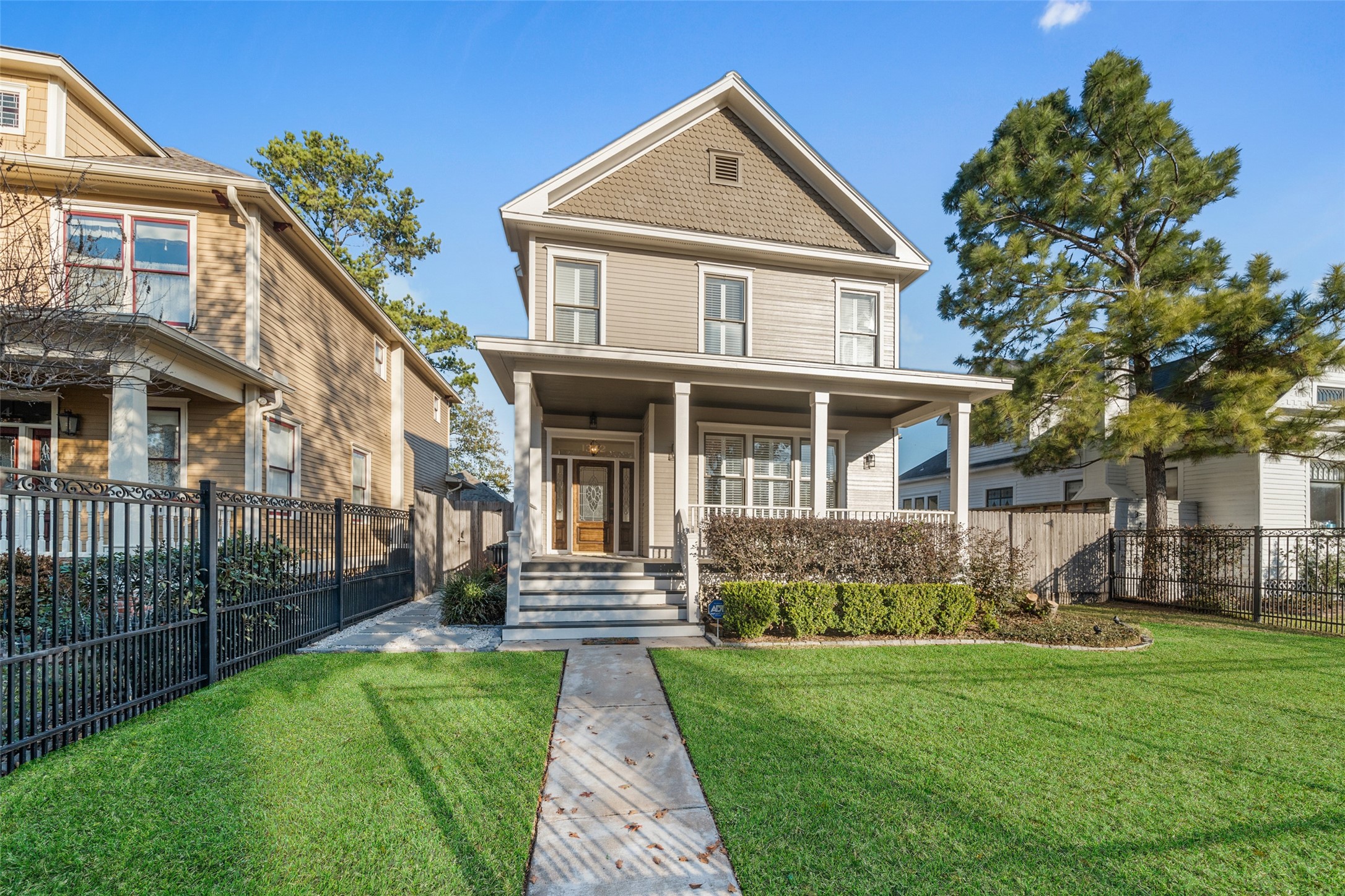 1342 Allston Street Houston, TX 77008 - Photo 4 of 39 Framed by a gated front yard, this freshly painted Heights home blends classic architecture with meaningful outdoor space.