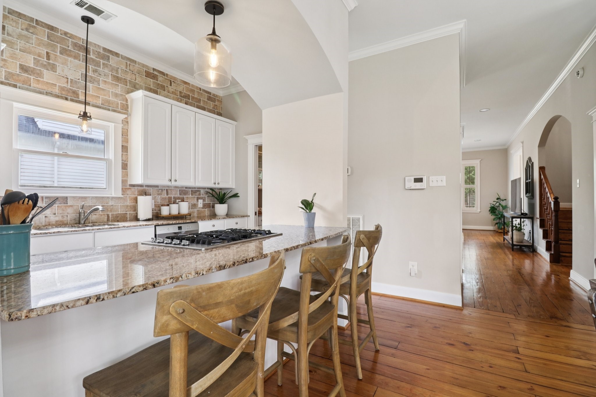 1342 Allston Street Houston, TX 77008 - Photo 10 of 39 Breakfast bar provides casual seating and defines the kitchen without closing it off from the living and dining areas.