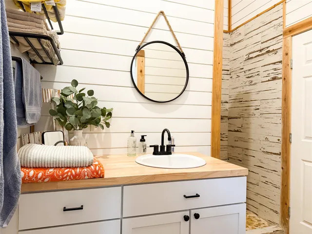 a bathroom with a sink and a mirror