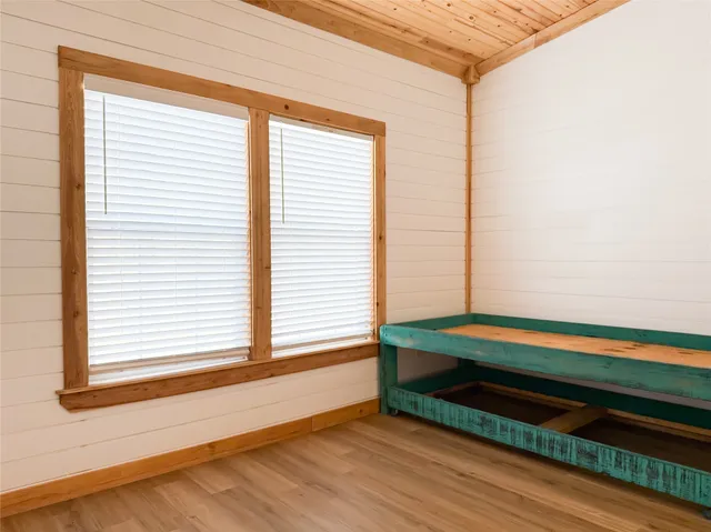 a room with window and a chair