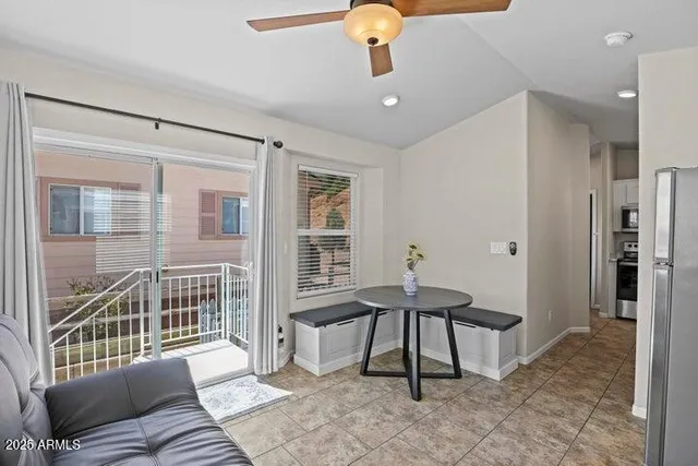 a view of a livingroom with furniture and windows