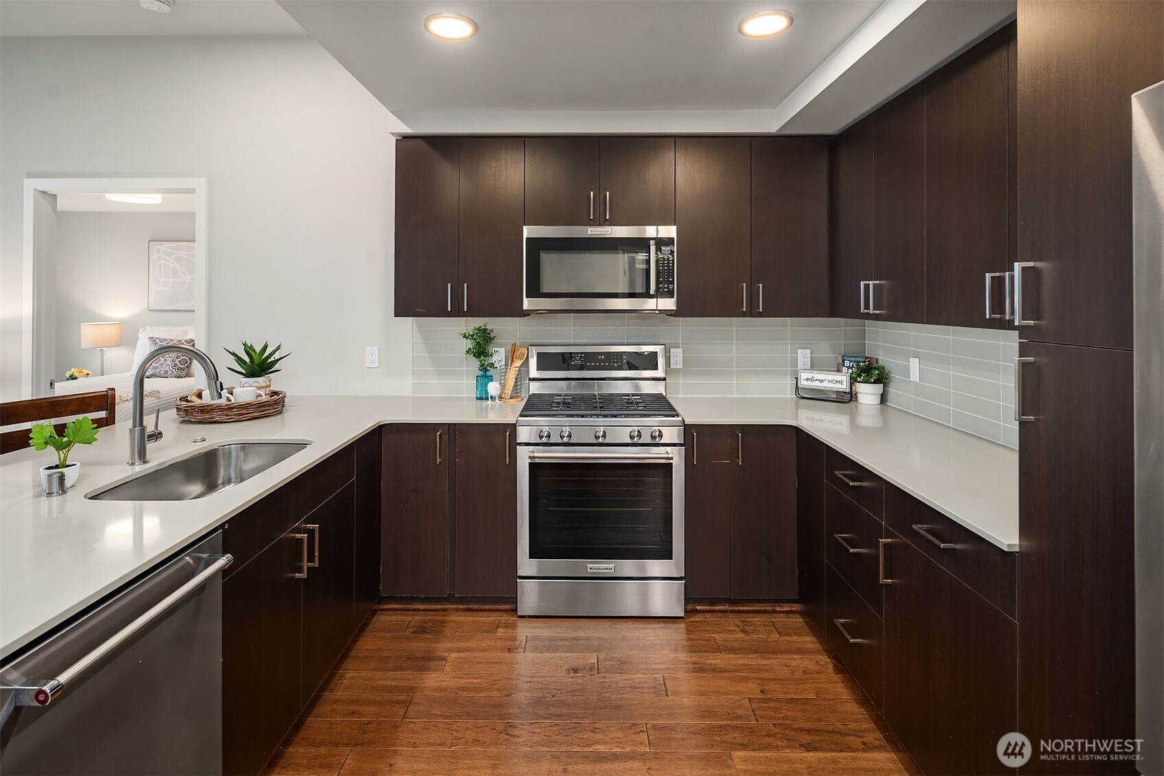 50 Pine Street, Unit 404 Edmonds, WA 98020 - Photo 14 of 33 a kitchen with a sink and stainless steel appliances