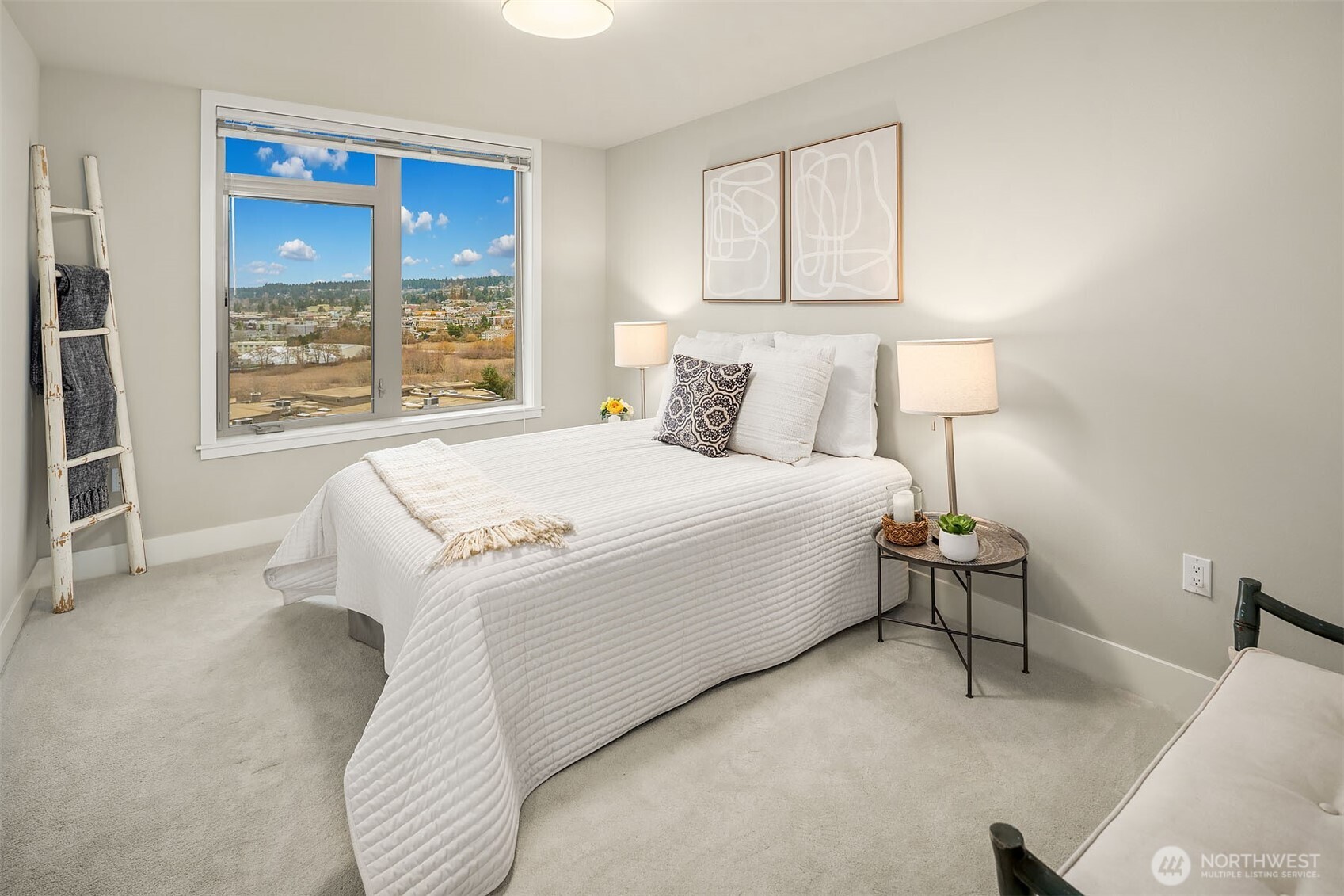 50 Pine Street, Unit 404 Edmonds, WA 98020 - Photo 16 of 33 a bed room with a bed and a chair