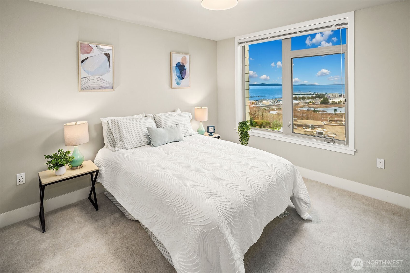 50 Pine Street, Unit 404 Edmonds, WA 98020 - Photo 20 of 33 a large bed sitting in a bedroom next to a window