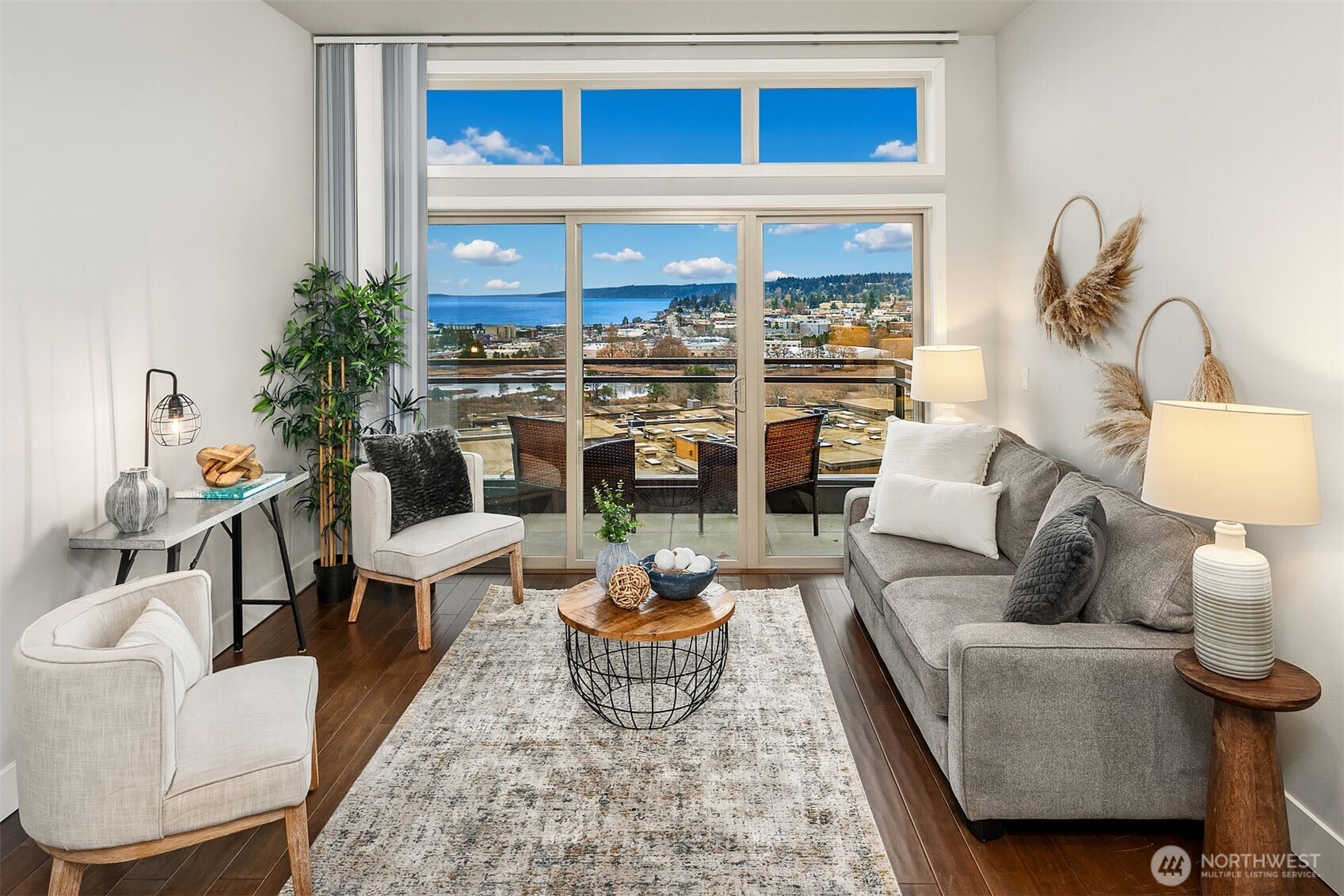 50 Pine Street, Unit 404 Edmonds, WA 98020 - Photo 2 of 33 a living room with furniture a lamp and a potted plant