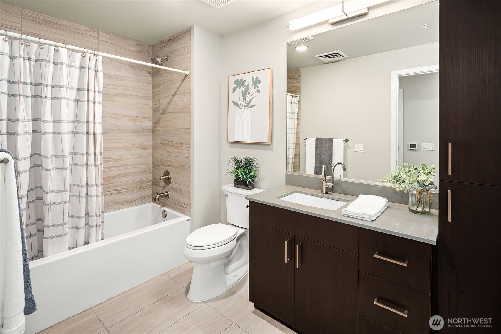 50 Pine Street, Unit 404 Edmonds, WA 98020 - Photo 22 of 33 a bathroom with a double vanity sink toilet and shower