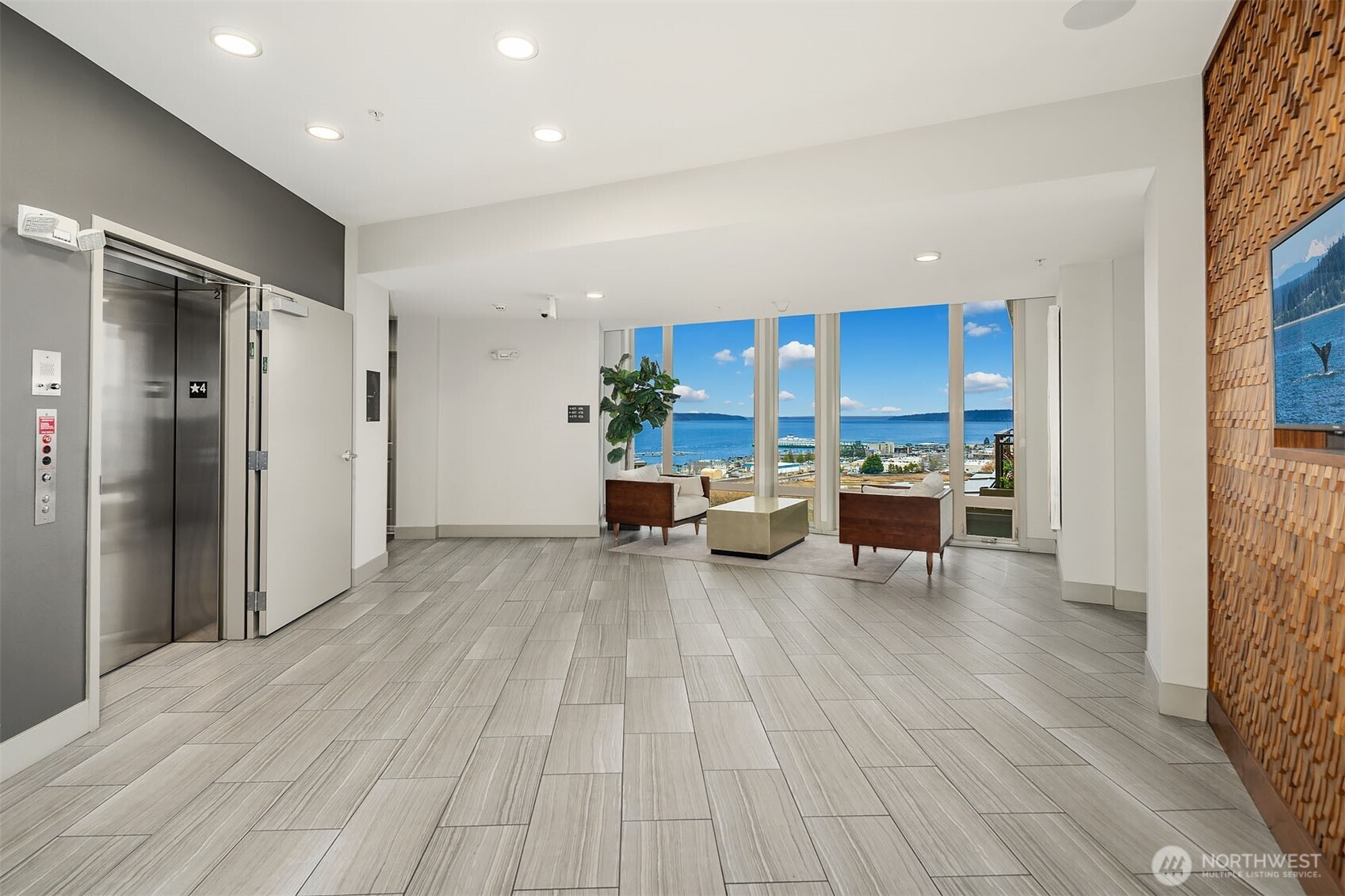 50 Pine Street, Unit 404 Edmonds, WA 98020 - Photo 29 of 33 a living room with furniture and a wooden floor