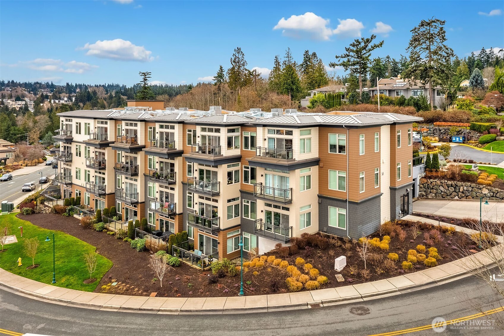 50 Pine Street, Unit 404 Edmonds, WA 98020 - Photo 30 of 33 a view of a house with backyard porch and sitting area