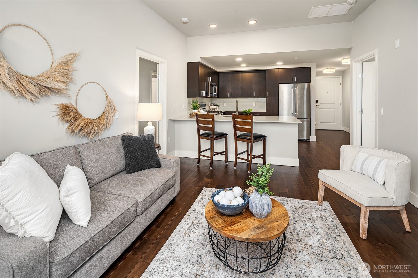 50 Pine Street, Unit 404 Edmonds, WA 98020 - Photo 9 of 33 a living room with furniture kitchen view and a large window