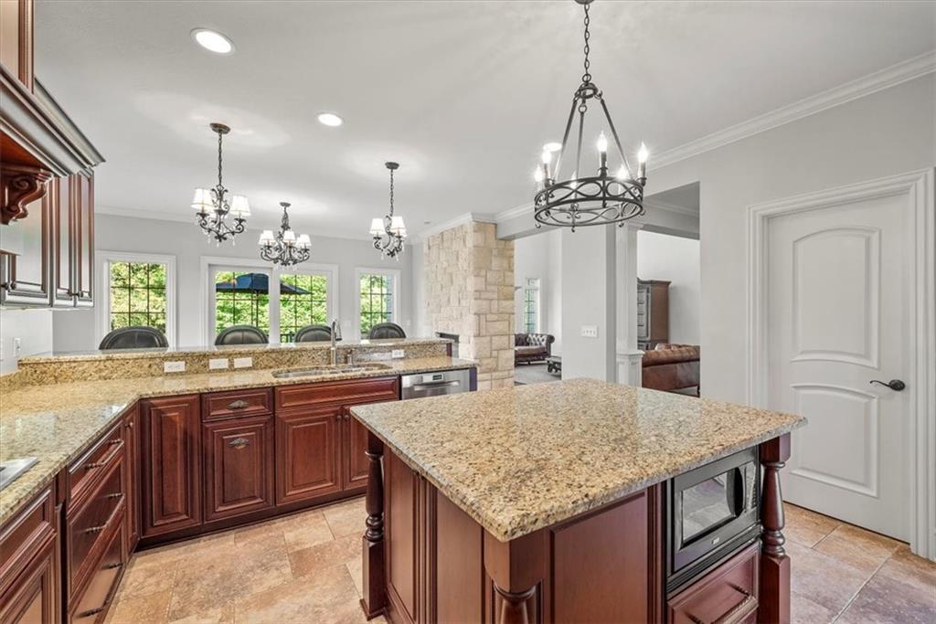 312 Cambridge Drive Mars, PA 16046 - Photo 11 of 50 a kitchen with center island and chandelier
