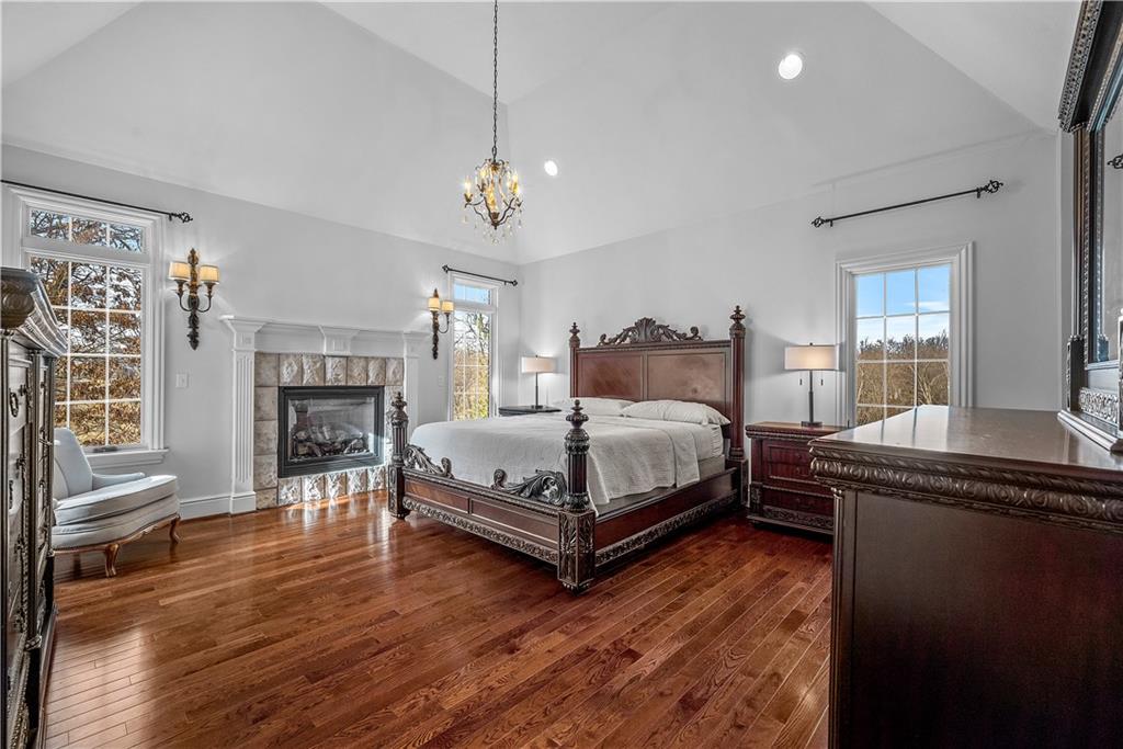 312 Cambridge Drive Mars, PA 16046 - Photo 21 of 50 a bedroom with a bed and a fireplace