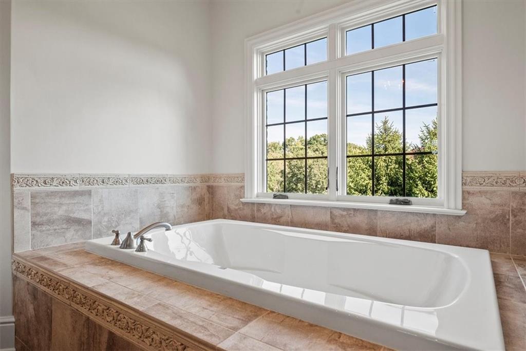 312 Cambridge Drive Mars, PA 16046 - Photo 24 of 50 a bath tub sitting next to a window