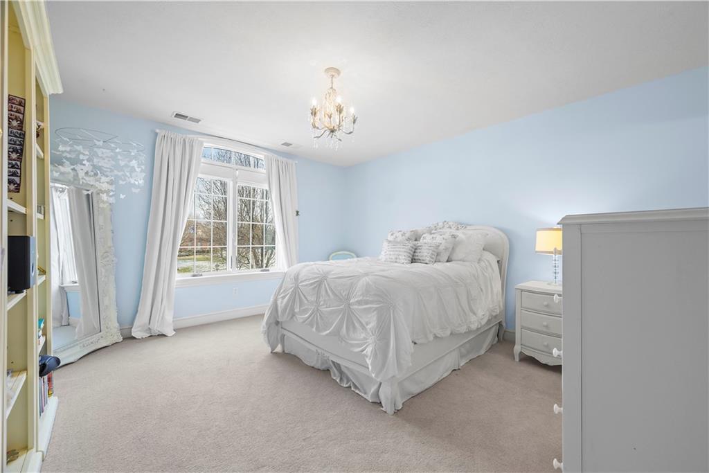 312 Cambridge Drive Mars, PA 16046 - Photo 25 of 50 a spacious bedroom with a bed and a window
