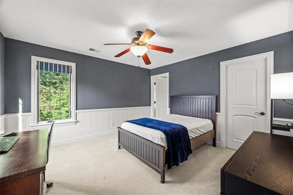 312 Cambridge Drive Mars, PA 16046 - Photo 27 of 50 a spacious bedroom with a bed and a couch