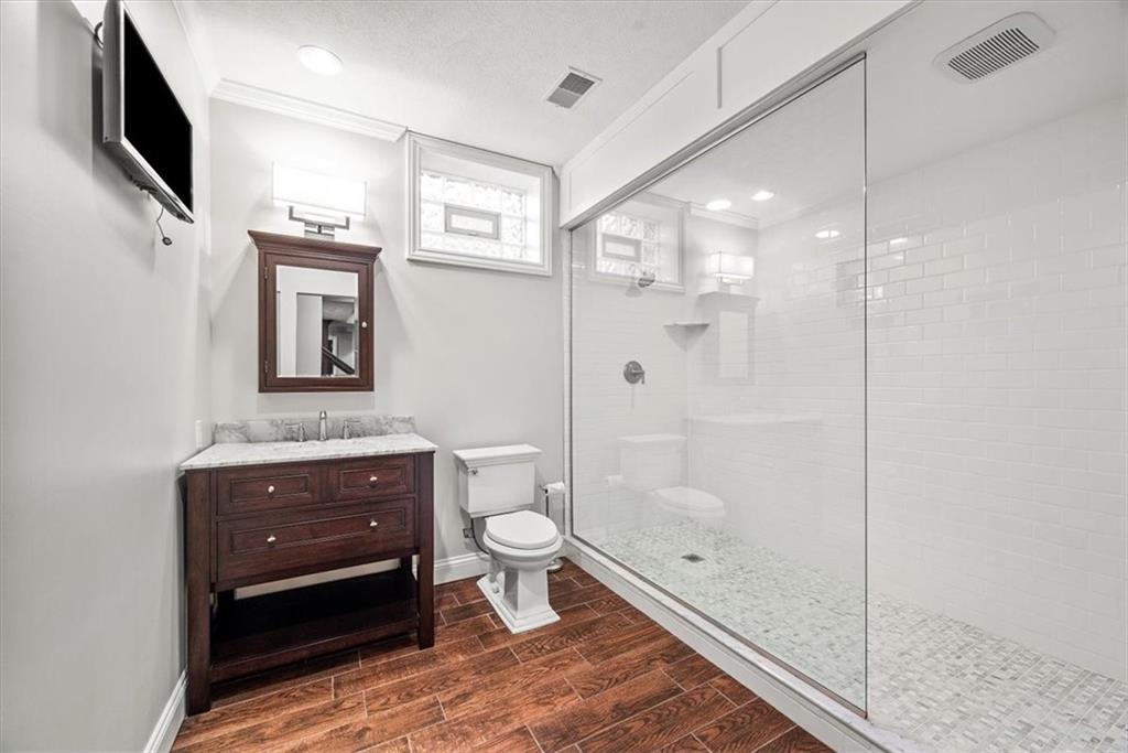 312 Cambridge Drive Mars, PA 16046 - Photo 34 of 50 a bathroom with a toilet a sink and glass door