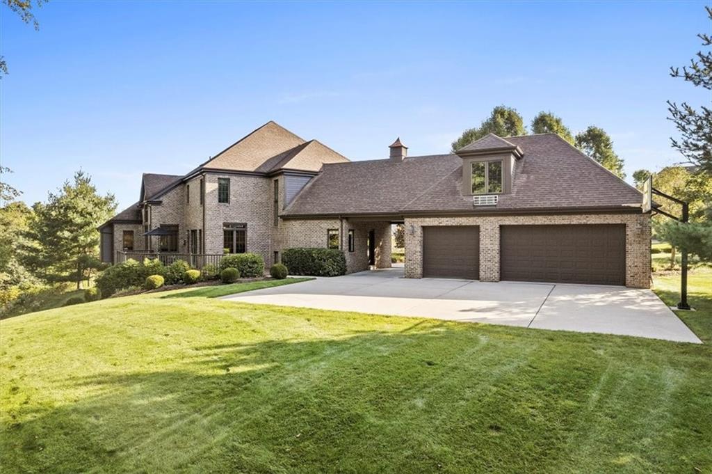 312 Cambridge Drive Mars, PA 16046 - Photo 43 of 50 a front view of a house with a yard and garage