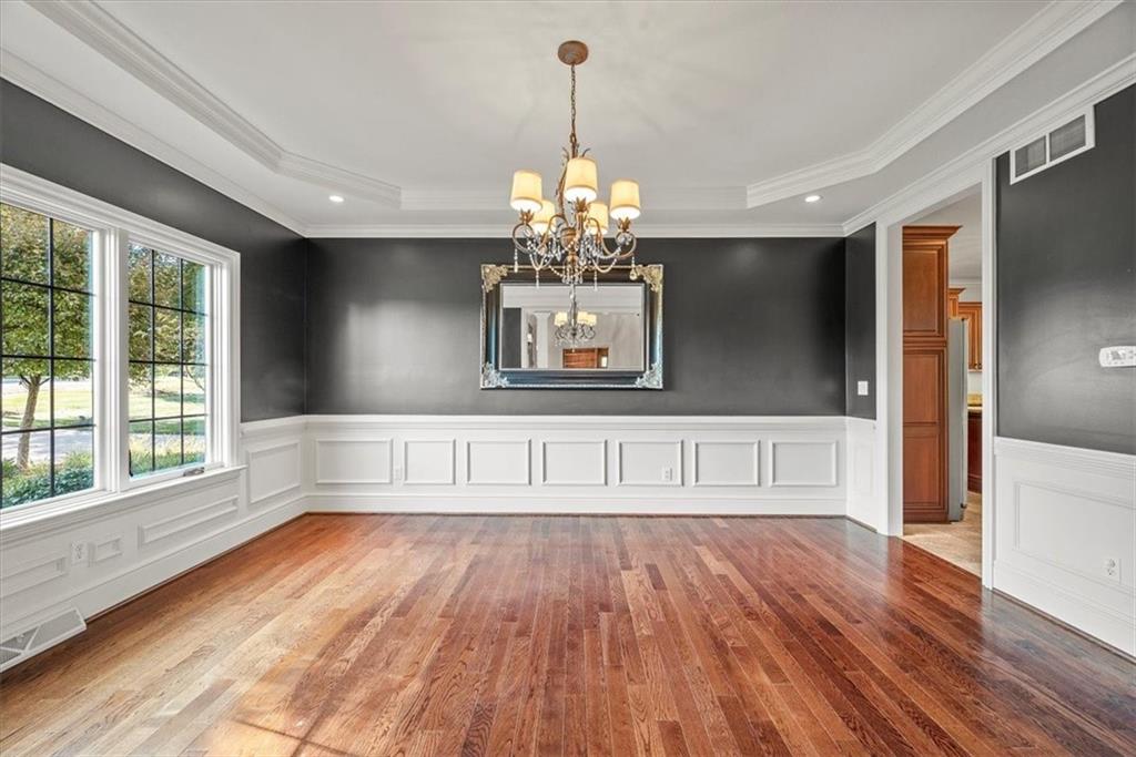 312 Cambridge Drive Mars, PA 16046 - Photo 5 of 50 a view of an empty room with wooden floor and a window