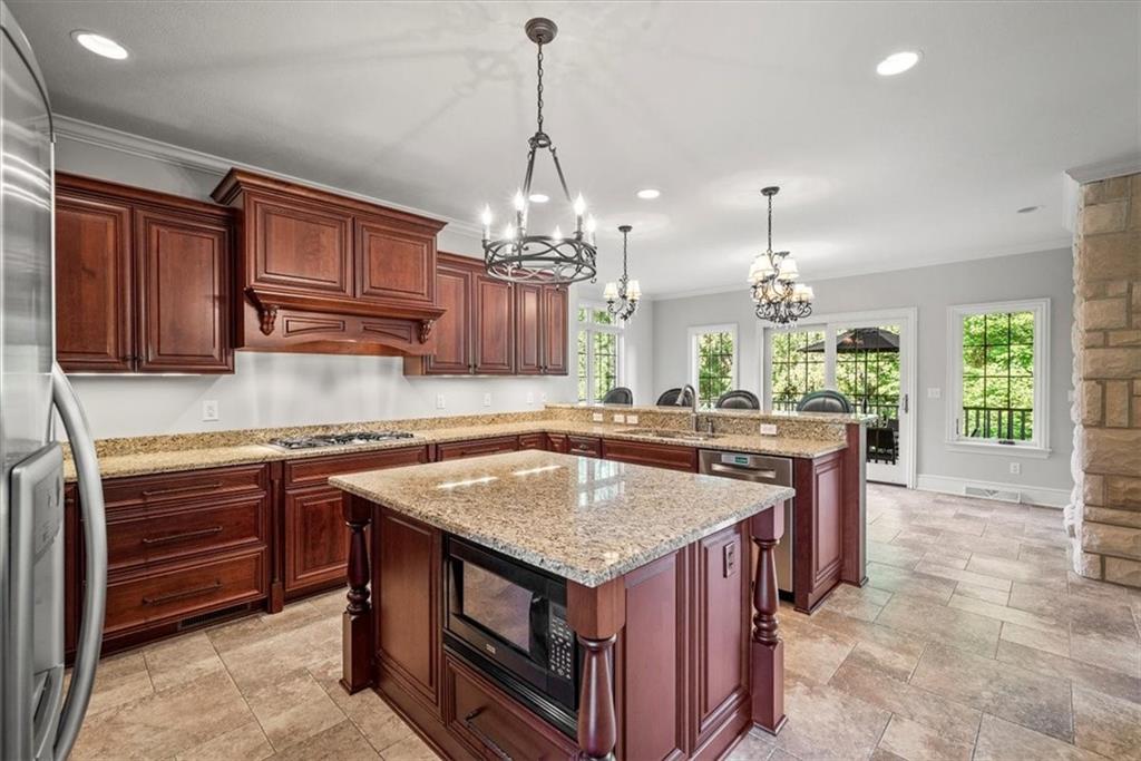 312 Cambridge Drive Mars, PA 16046 - Photo 9 of 50 a kitchen with a stove center island and windows