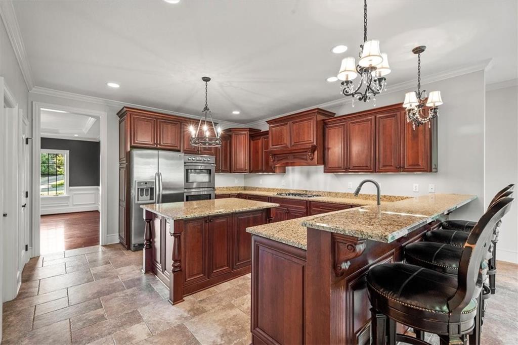 312 Cambridge Drive Mars, PA 16046 - Photo 10 of 50 a kitchen with a stove a refrigerator and a sink