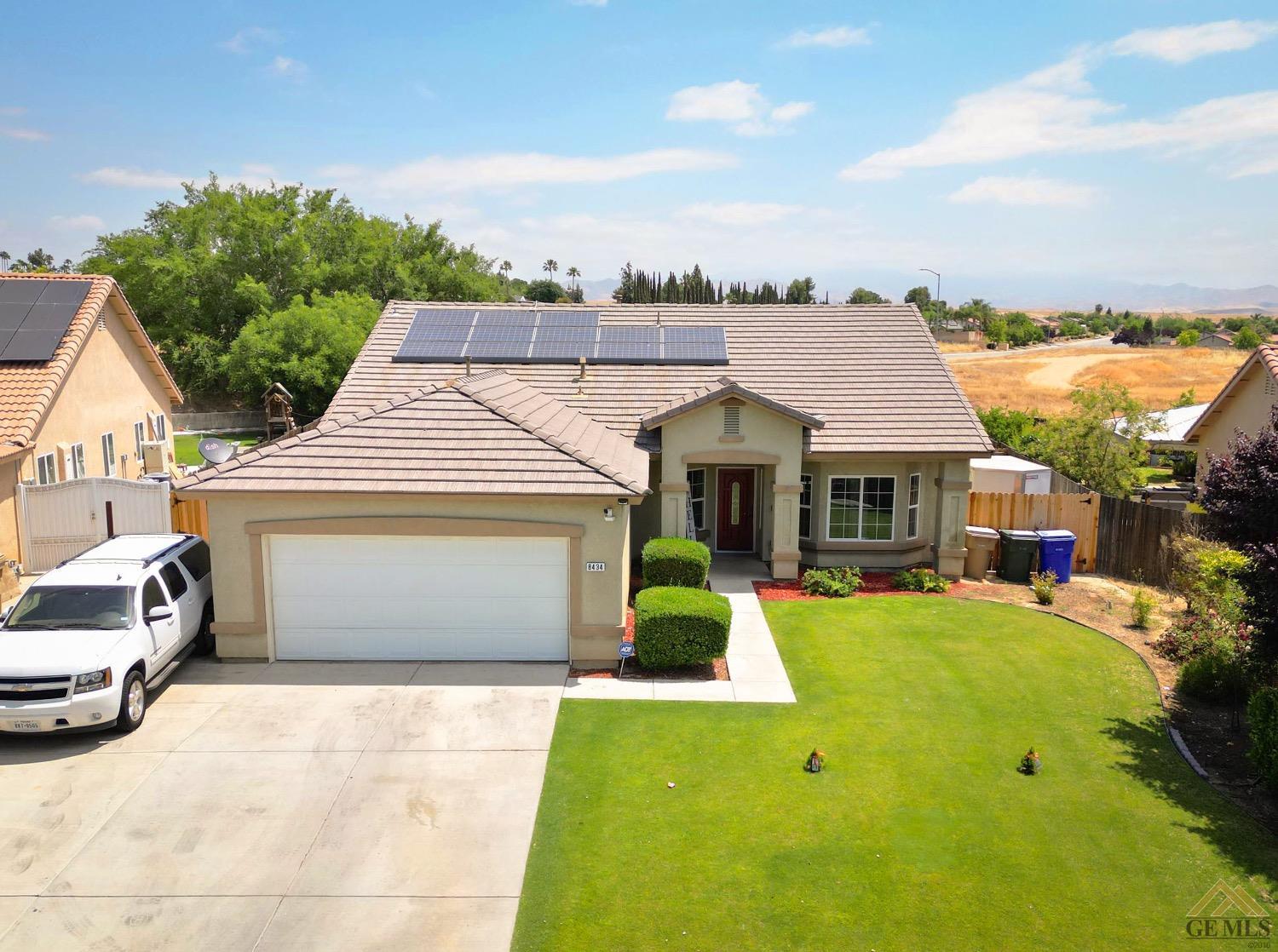 Undisclosed Address Bakersfield, CA 93306 - Photo 1 of 29 a front view of a house with yard patio and fire pit