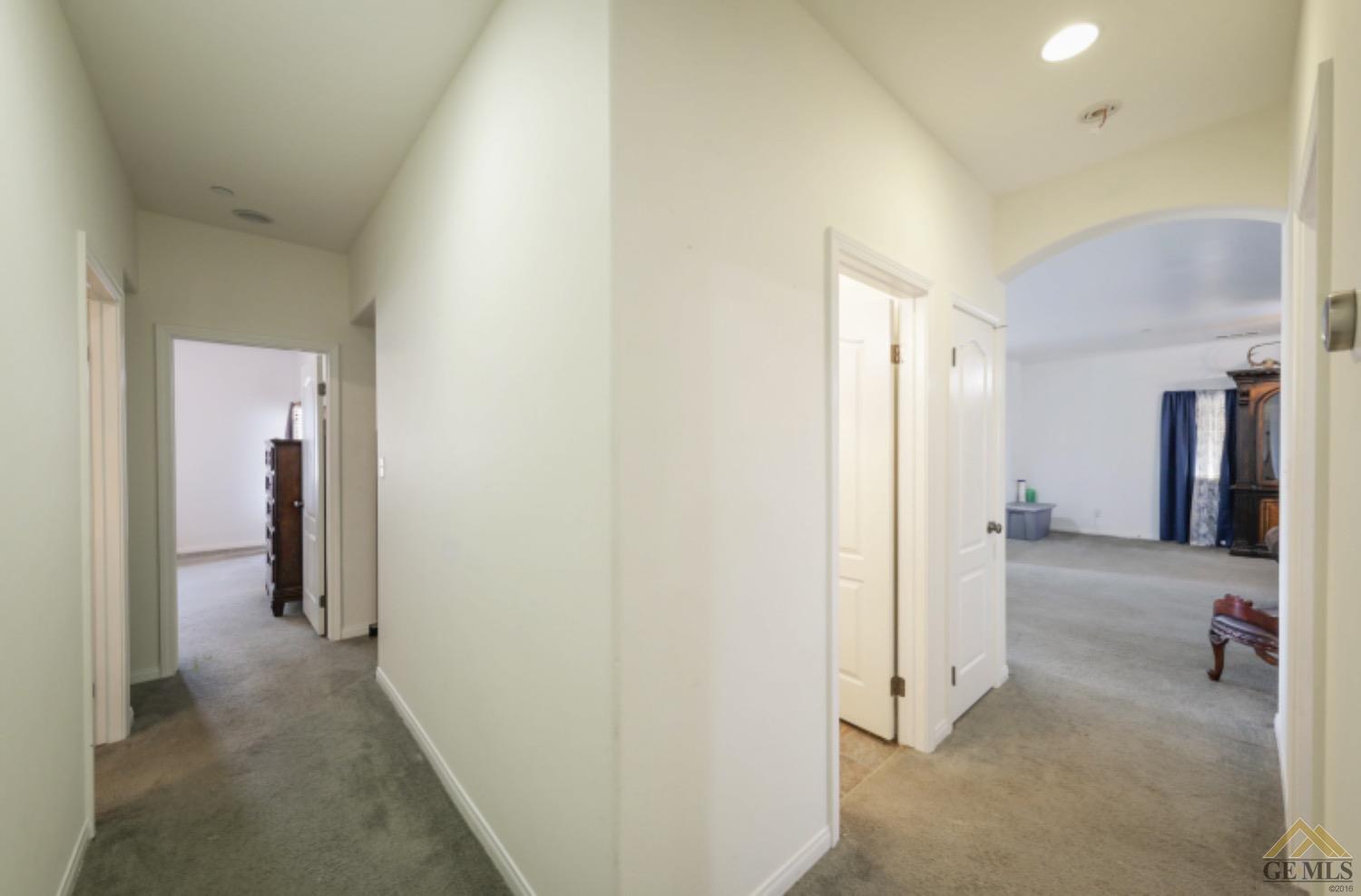 Undisclosed Address Bakersfield, CA 93306 - Photo 12 of 29 a view of a hallway with wooden shelves