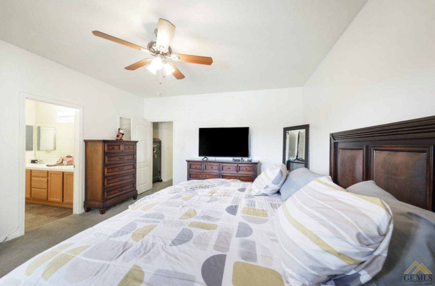 Undisclosed Address Bakersfield, CA 93306 - Photo 15 of 29 a bedroom with a bed and a television