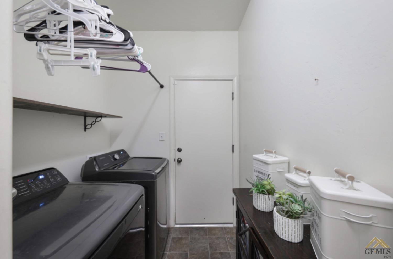 Undisclosed Address Bakersfield, CA 93306 - Photo 17 of 29 a utility room with dryer and washer