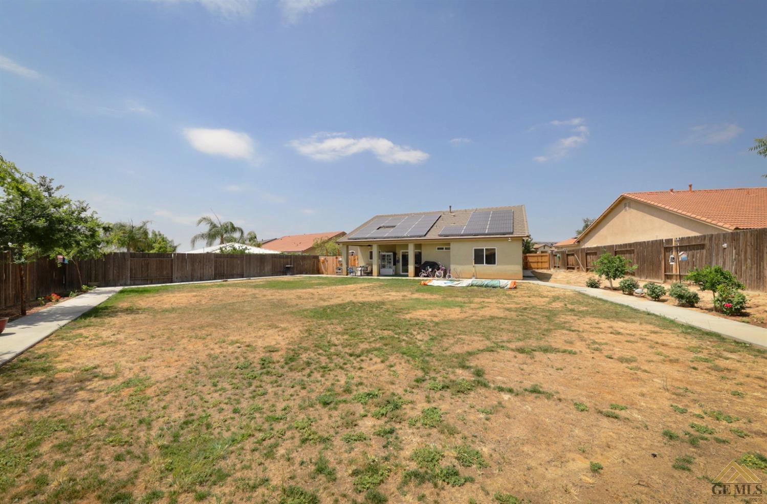 Undisclosed Address Bakersfield, CA 93306 - Photo 24 of 29 a front view of a house with a yard