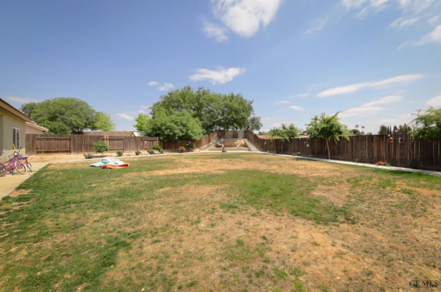 Undisclosed Address Bakersfield, CA 93306 - Photo 26 of 29 a view of a garden with a house