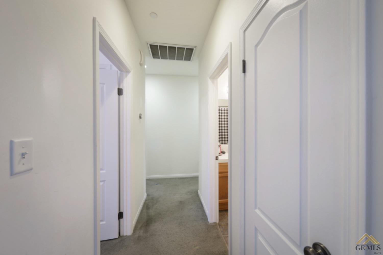 Undisclosed Address Bakersfield, CA 93306 - Photo 9 of 29 a view of a hallway with a door