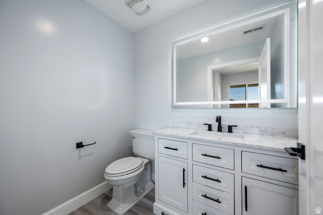 476 Spring Drive Toquerville, UT 84774 - Photo 61 of 95 Half bathroom featuring vanity and wood finished floors