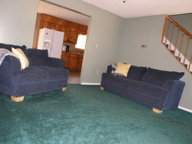 434 Homer Roberts Road Gray, GA 31032 - Photo 8 of 12 a living room with furniture and a couch