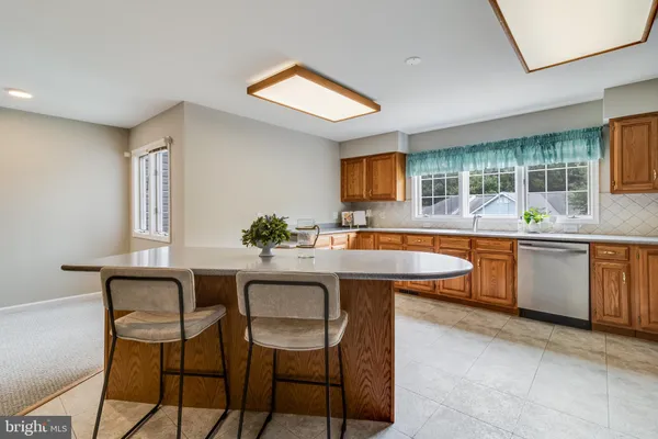 a kitchen with a sink and a stove
