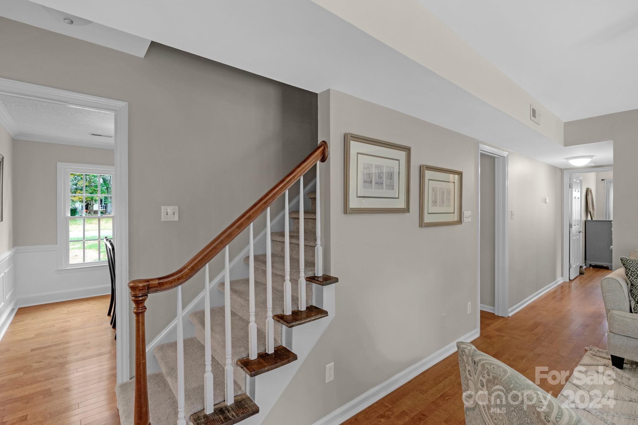 406 Sandymead Road Matthews, NC 28105 - Photo 22 of 48 a view of entryway and hall with wooden floor