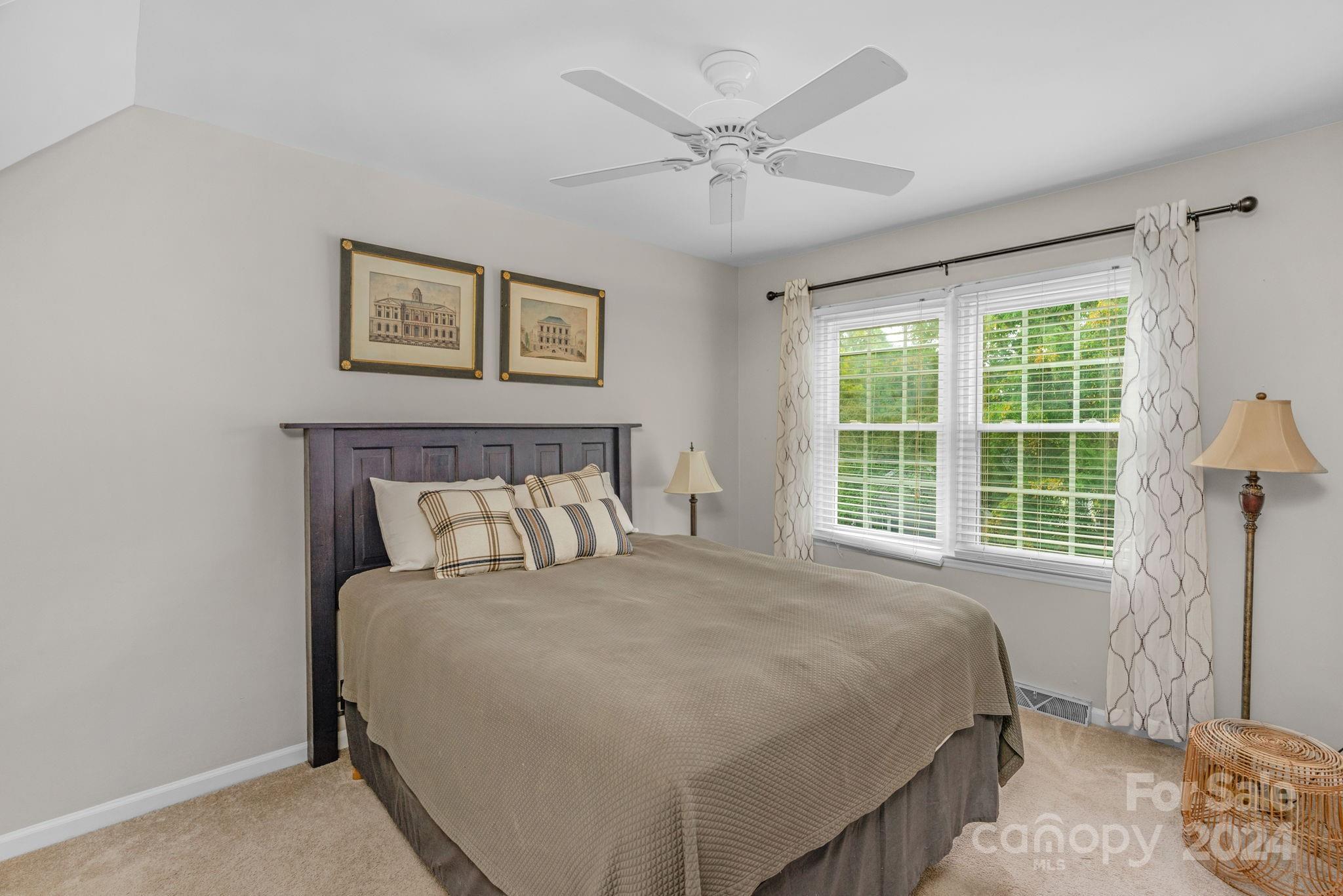 406 Sandymead Road Matthews, NC 28105 - Photo 26 of 48 a bedroom with a large bed and a window